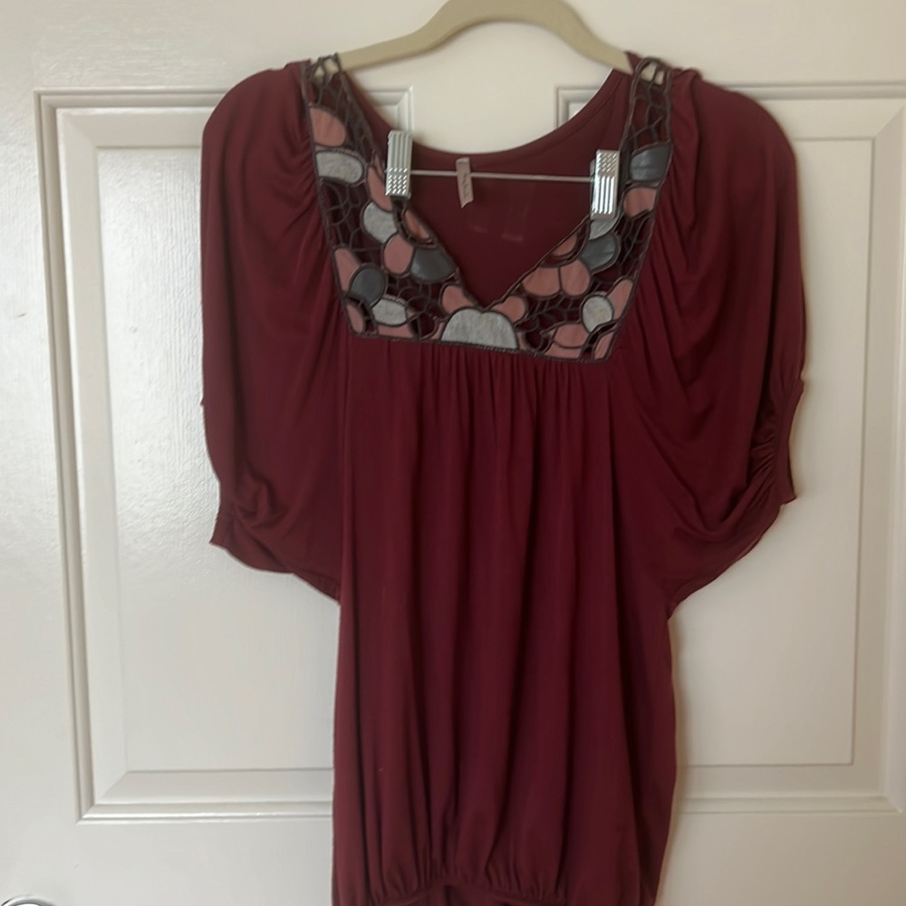 Women’s tunic with leather and cloth embroidery